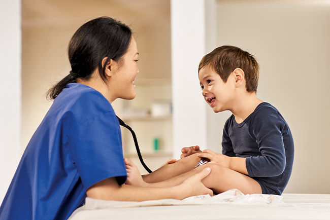 Pediatrics nurse in front of an incubator on neonatology ward