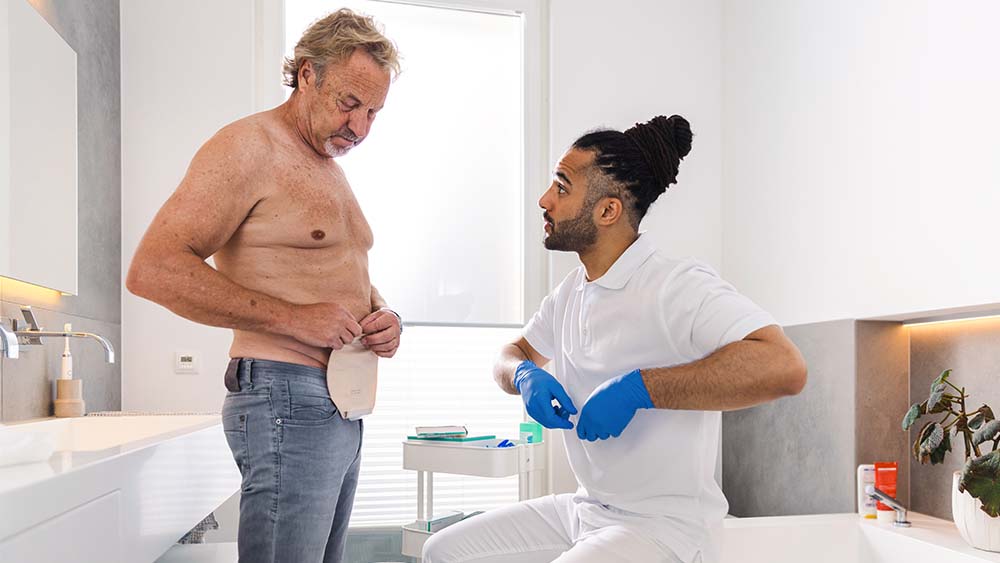 A patient was shown by a medical professional how to put on a B. Braun ostomy bag in the comfort of her own home.
